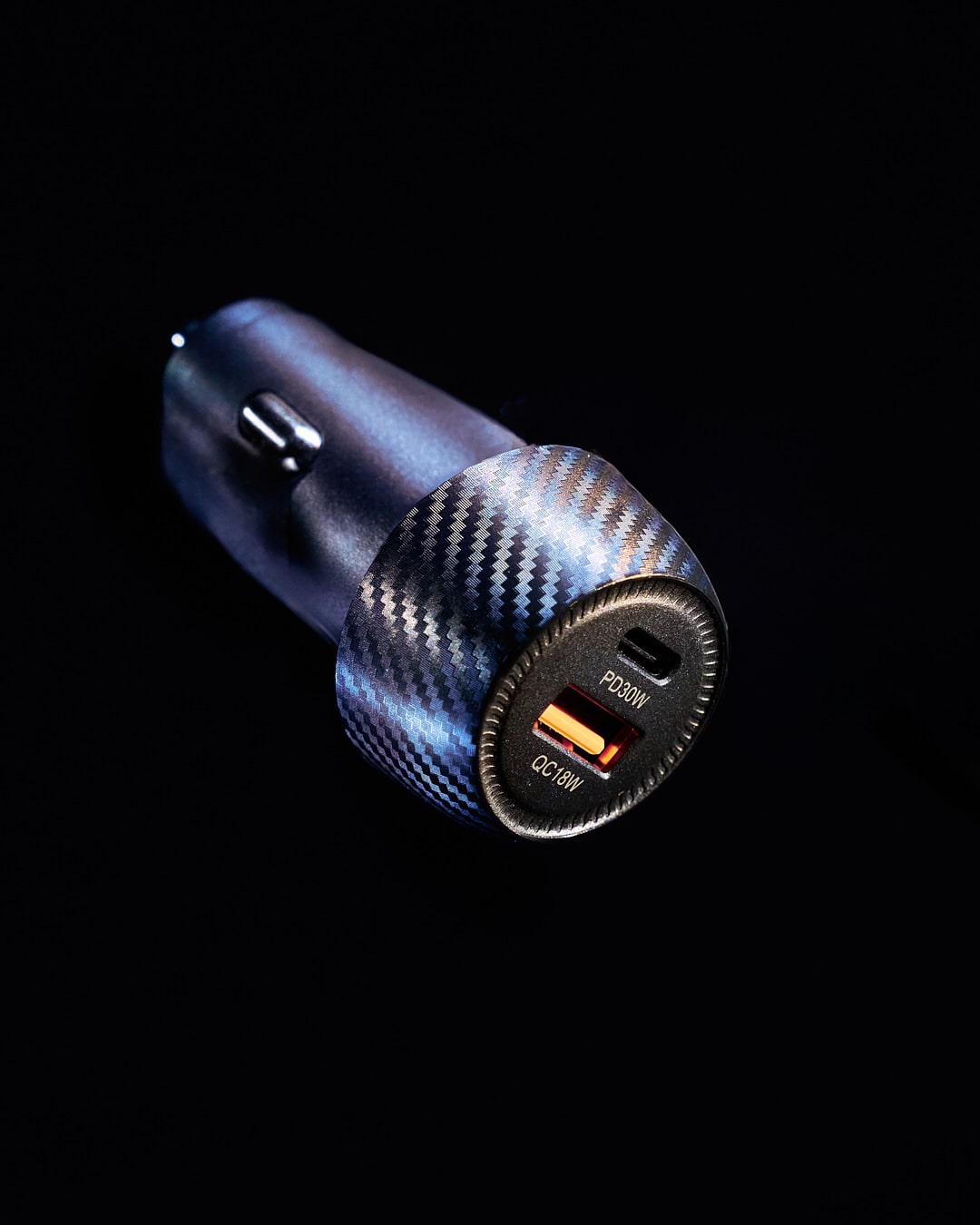 Black car cigarette lighter adapter with a connecting cable.